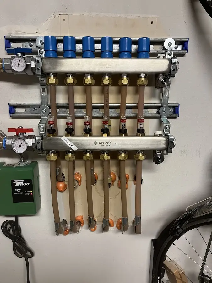 Plumber performing Water Heater Repair at a residential property in Howland Center